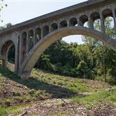 Concrete Rail Bridge with Graffiti and stream
