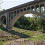 Concrete Rail Bridge with Graffiti and stream