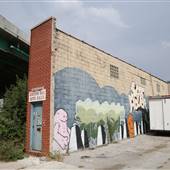 Wedge Building under Overpass with Graffti