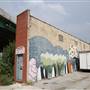 Wedge Building under Overpass with Graffti
